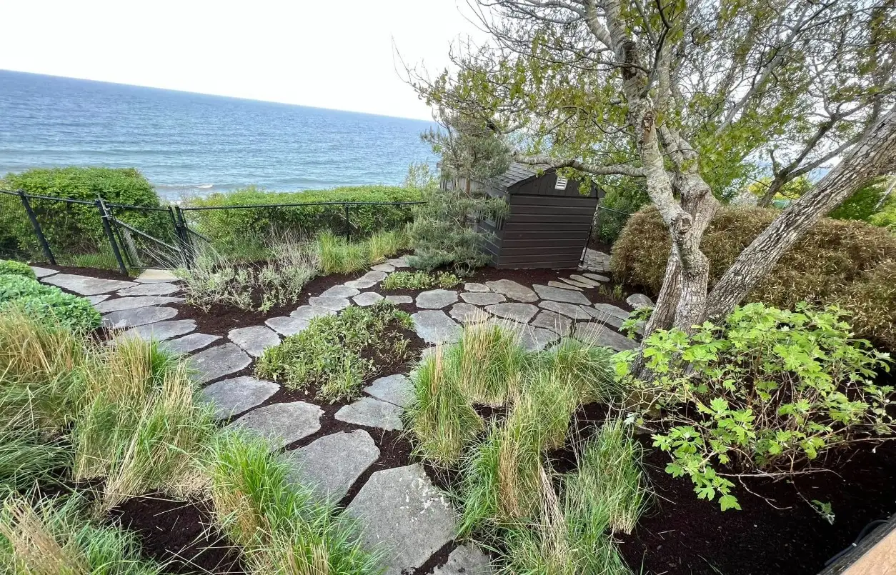 Backyard cleanup and mulch installation project by Medhaug Landscaping in Plymouth MA